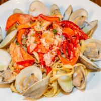 Fettuccine With Lobster & Whole Clams · Garlic olive oil white wine sauce.
