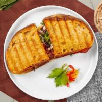 Chicken & Bacon Panini · Everroast chicken and bacon served on a flat panini bread.