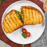 Mediterranean Panini · Boar's head chicken breast, feta cheese, baby spinach, and tomatoes served on a flat panini ...