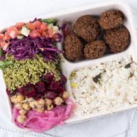 Falafel Rice Bowl · Rice Bowl with your choice of salad bar items and sauces and topped with our specialty - Fal...