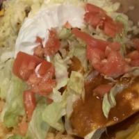 Burritos · Tortilla de harina con arroz amarillo y frijoles vegetales salteados, crema y queso Oaxaca. ...