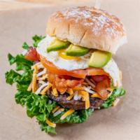 Power Play Burger · with Cheddar Jack Cheese, Fried Egg, Avocado, Bacon, Lettuce & Tomatoes