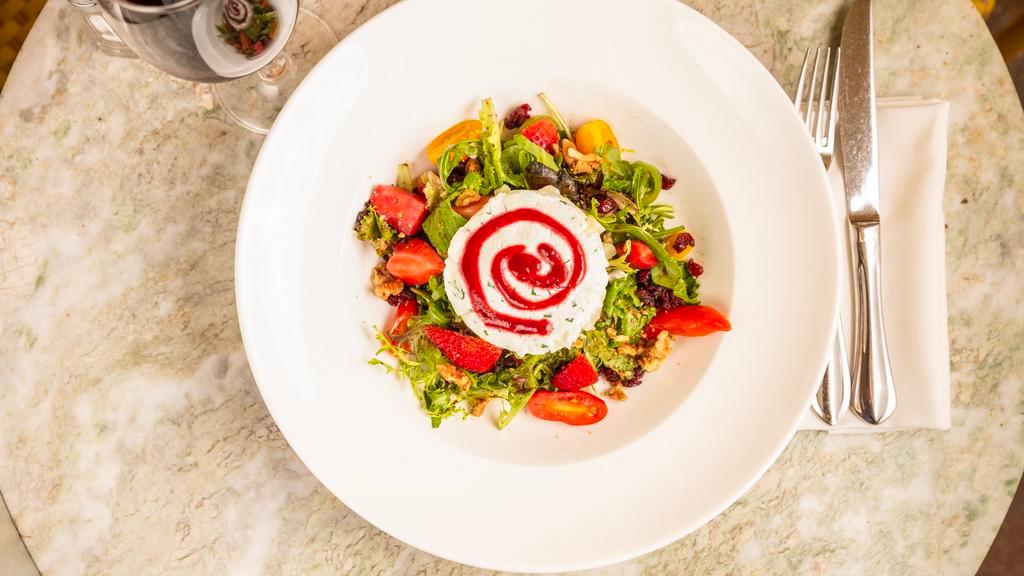 Warm Goat Cheese Cake · Warm Goat Cheese Salad… Mesclun topped with grilled marinated goat cheese, tomato confit, black olives