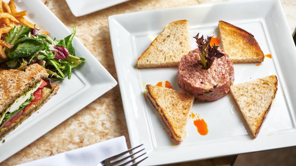 Chicken Liver Mousse · House Duck pâté… A slice of Country style duck and pork pate served with tomato, cornichons, Dijon mustard, a garnish of mesclun, and a toast