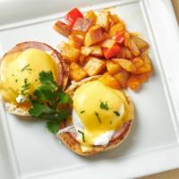 Eggs Benedict · Two organic poached eggs served on seared Canadian bacon and toasted English muffin, topped ...