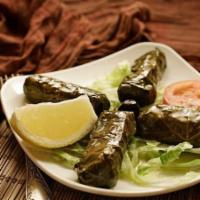 Stuffed Grape Leaves · Grape leaves filled with rice, onions,  herbs, spices, evoo. no pine nuts.
