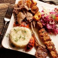 Mixed Grill · An assortment of lamb chop, chicken adana, lamb shish, chicken kebab, and homemade gyro, wit...