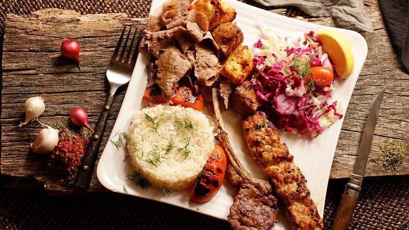 Mixed Grill · An assortment of lamb chop, chicken adana, lamb shish, chicken kebab, and homemade gyro, with rice and salad.