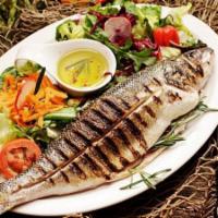 Mediterranean Sea Bass · Whole mediterranean sea bass chargrilled to a crispy perfection. served with salad