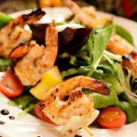 Grilled Jumbo Shrimp · Char-grilled six pieces of jumbo shrimp skewers served with rice and salad.