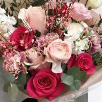 Lovey Doves · A lovely hand-tied bouquet featuring various shades of pink florals along with white and gre...