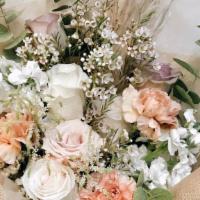 Peached · A soft, beautiful hand-tied bouquet featuring peach and neutral toned florals with greens.

...