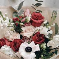 Cheeks · A charming hand-tied bouquet featuring deep shades of pink and red florals, with neutral ton...
