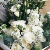 Grace · Classic green and white hand-tied bouquet.

*Photo serves as a style reference. Flower palet...