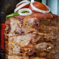  Doner Kebab  · Homemade Gyro - Thinly sliced lamb and beef marinated with chef`s own secret blend of season...