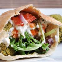 Falafel Sandwich · Falafel Sand Comes with Lettuce Onions and tomato  with Tahini Sauce