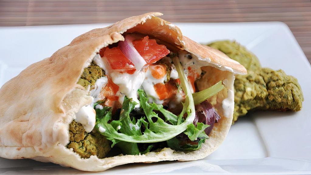 Falafel Sandwich · Falafel Sand Comes with Lettuce Onions and tomato  with Tahini Sauce