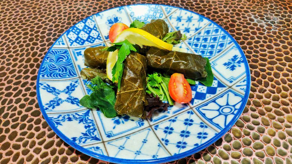 Stuffed Grape Leaves · Homemade grape leaves stuffed with special seasoned rice and pine nuts topped with olive oil
