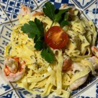Shrimp Fettuccine Alfredo · This shrimp alfredo pasta is made with fettuccine in a creamy parmesan sauce, Mushroom toppe...