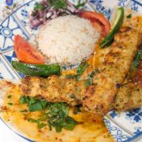 Chicken Adana · Hand chopped chicken flavored with bell red peppers , parsley seasoned with paprika and serv...