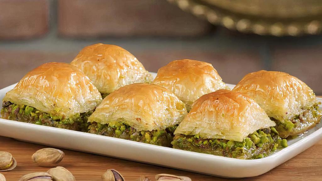 Baklava · Baklava uses phyllo dough stacked with honey and pistachio to make a sweet Turkish dessert