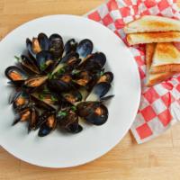 Mussels In White Wine · 20 Mussels served in White Wine with Garlic and Thyme.