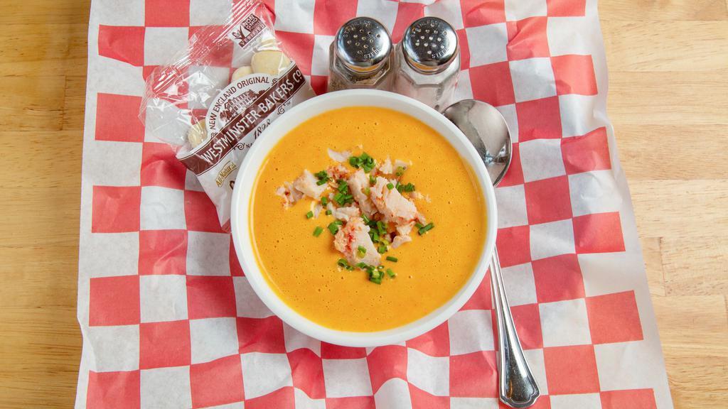 Lobster Bisque · Creamy lobster bisque topped off with a scoop of lobster meat.