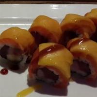Ben Ben Roll · Tuna, yellowtail, and white tuna inside; topped with salmon, mango and chef's special sauce.