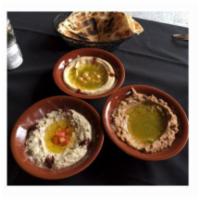 Hummus · A classic Mediterranean dip, chickpeas, tahini, garlic and lemon juice.
