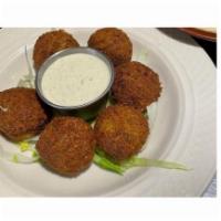 Falafel · Ground chickpeas, mixed with our own spices then formed into balls and fried.
