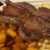 Steak · Grilled steak served over your choice of mac salad, home fries or baked beans.