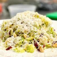 Brussel Sprout Salad · Nuts, gluten free, vegetarian. Brussels sprout, aged parmigiano, dried cranberries, toasted ...