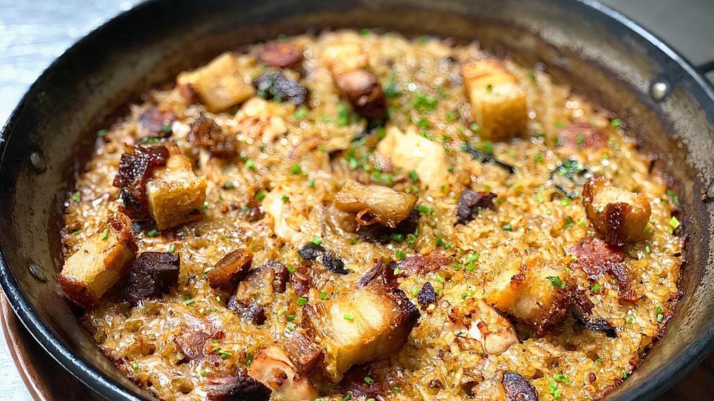 Paella De Carne · Gluten free. Classic Spanish bomba rice, sofrito, saffron, mushrooms, pork belly, chicken, chorizo, fillet mignon.