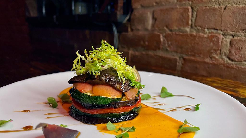 Goat Cheese & Eggplant Terrine · Gluten free, vegetarian. Goat cheese, grilled eggplant, zucchini, roasted peppers, confit tomato, piquillo pepper puree, balsamic reduction, mushrooms.