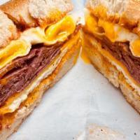 Pastrami And Egg Sandwich With Swiss Cheese · Add croissant and extra cheese for an additional charge.