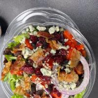 Sub Master Salad · Romen lettuce  topped with red onion, grape tomatoes, red pepper, , raisins, dried cranberri...