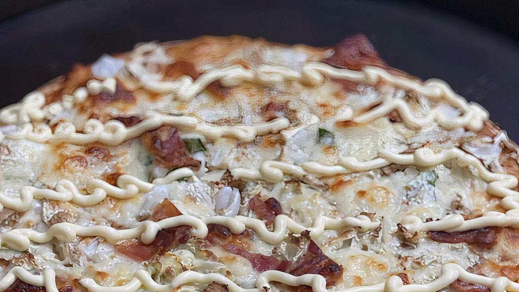 Okonomiyaki Pizza · Our unique pizza is straight from the city markets of Tokyo, if you have ever had okonomiyaki, you'll love this pizza!