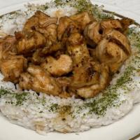 Sake Chicken · Slow-cooked chicken with a sweet sake glaze over a bed of rice.