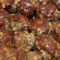 Momma Meow'S Bbq Meatballs · Four large beef meatballs baked and covered in a decadent BBQ sauce served with rice.