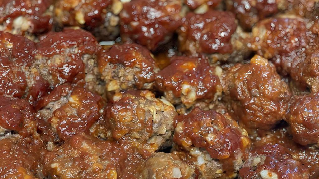 Momma Meow'S Bbq Meatballs · Four large beef meatballs baked and covered in a decadent BBQ sauce served with rice.