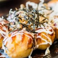Takoyaki 章鱼小丸子 · 6 pieces Japanese style octopus balls。 Topped with homemade mayo and takoyaki sauce。