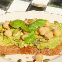 Hummus Avocado Toast · Avocado, Hummus, Pesto mixed toast. Chickpeas and pumpkin seeds on top.
Sourdough bread