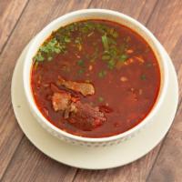 Borsch Soup · Eastern European soup with meat, beets, cabbage, and fresh herbs.