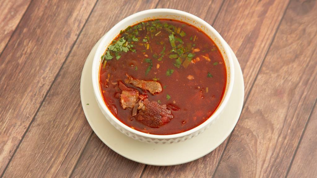 Borsch Soup · Eastern European soup with meat, beets, cabbage, and fresh herbs.