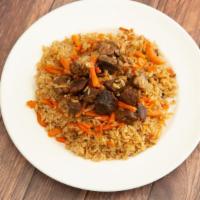 Uzbek Pilaf · Rich rice with juicy meat and carrots. Spiced with cumin and saffron.