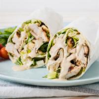 Chicken Caesar Wrap · Grilled chicken, Romaine lettuce, croutons, and grated parmesan cheese with Caesar salad dre...