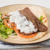 Greek Gyro · Gyro meat, lettuce, tomato, and red onions with gyro sauce on  pita bread.