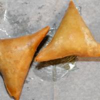 Vegetable Samosa · Two pieces.