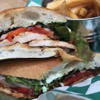 Grilled Chicken Sandwich · Grilled Chicken Breast, roasted Red Peppers, fresh Mozzarella, White Onions, and Lettuce top...