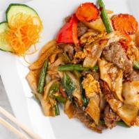 Pad Kee Mao (Drunken Noodles) · Spicy level two. Flat rice noodle mixed bell peppers, string beans, carrots, onions, and egg...